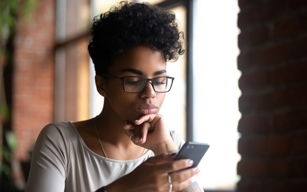 A woman looking at her phone.
